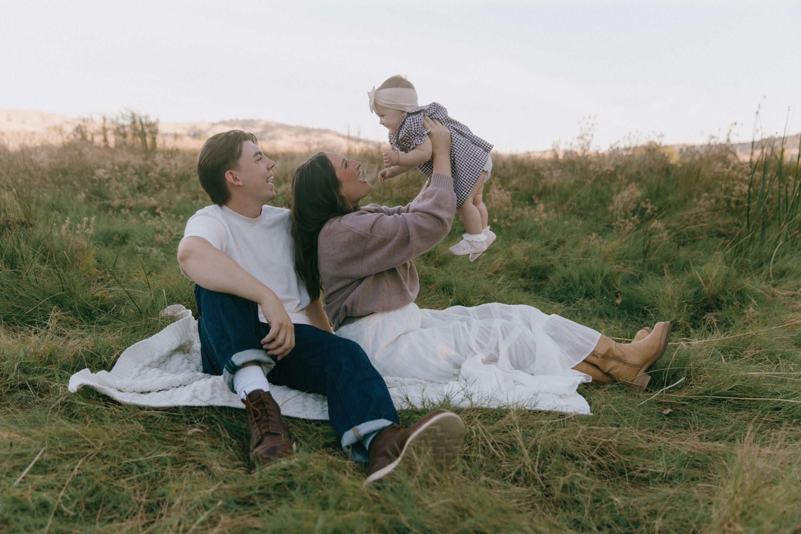 Family playing in the grasses at Lagoon Valley Park in Vacaville, California